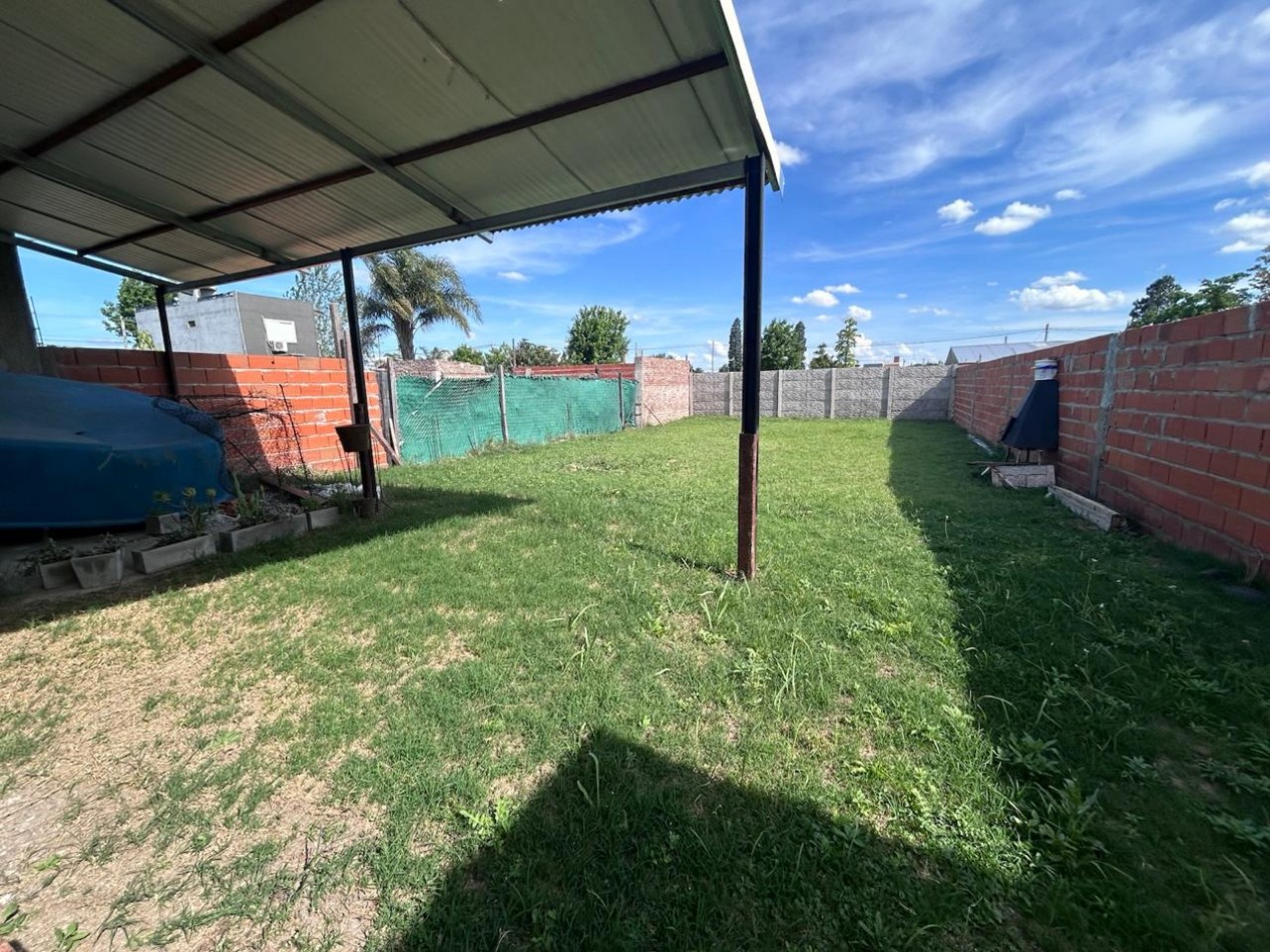 Parque Habitacional Ibarlucea, casa dos dormitorios con patio amplio, terreno de 300 m2